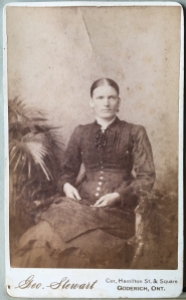 Photo 27: Seated woman. Photographer Geo. Stewart, Cor. Hamilton St. & Square, Goderich, Ontario.